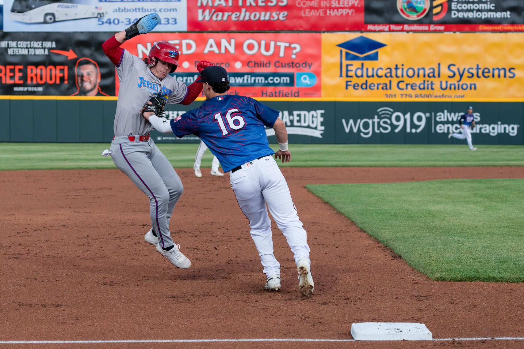 FREDERICK, MD - Carter Mathison (4) of the Jersey Shore BlueClaws is tagged out at third base by Colin Yeaman (16) of the Frederick Keys during the game in Frederick, Maryland.