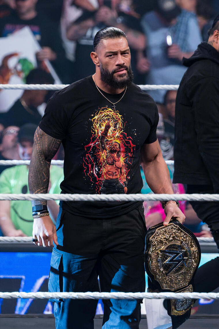 BALTIMORE, MD - Roman Reigns holds the championship belt before addressing the crowd during the June 15, 2026 WWE event at CFG Bank Arena in Baltimore, Maryland.