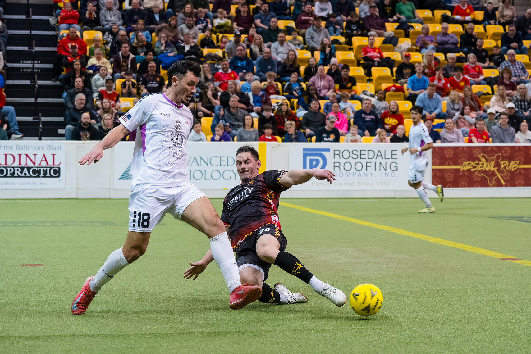 BALTIMORE, MD – Empire Strykers midfielder Mohamed Ndiaye (18) controls the ball under pressure from Baltimore Blast defender Mike Deasel (20) during a Major Arena Soccer League match on February 1, 2026, at SECU Arena.